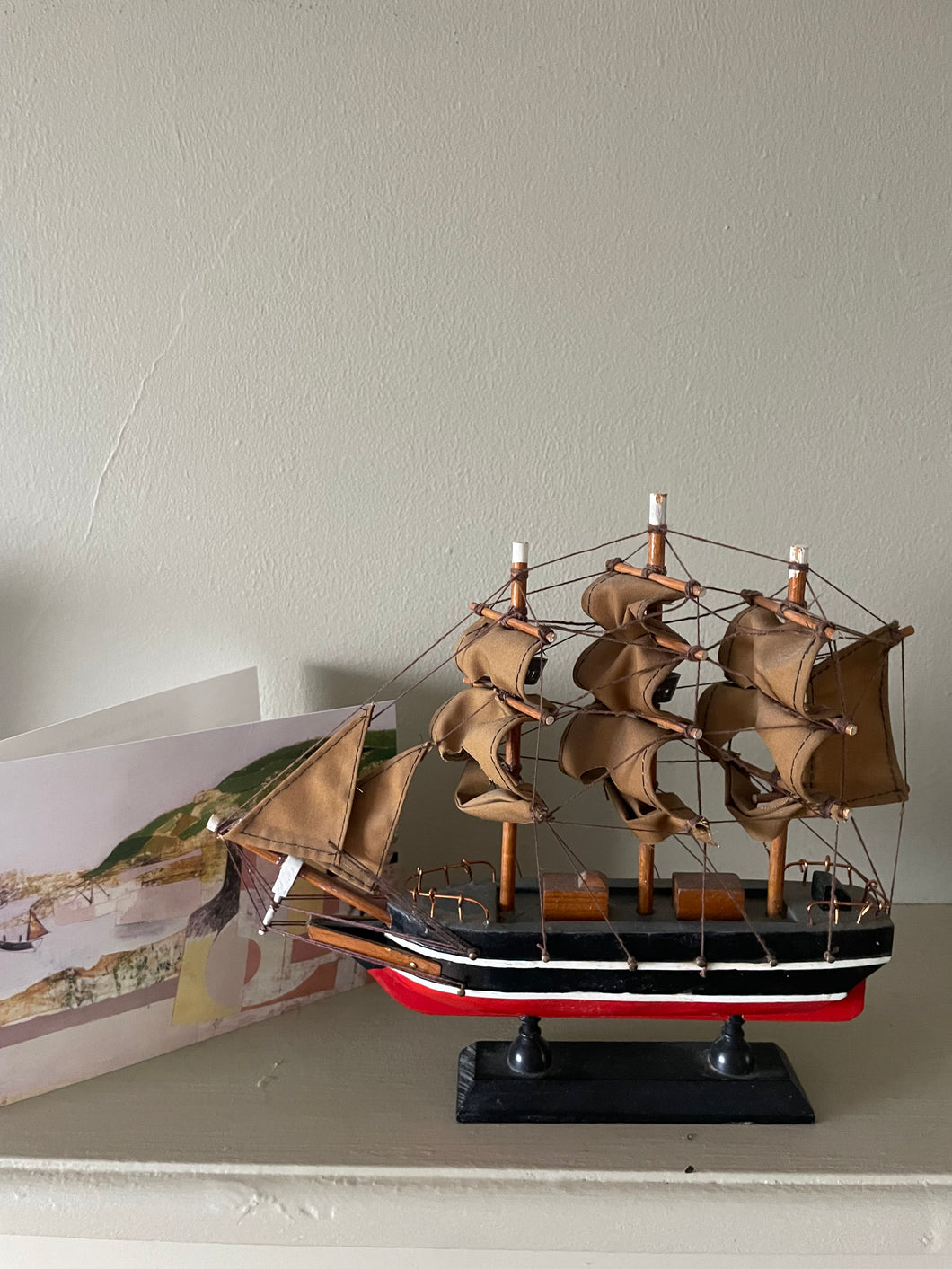 Antique model ship in red